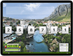 A thumbnail of a landscape iPad displaying a screen from This=That which shows Foča town and the river, in Bosnia and Herzegovina as the backdrop of the app.